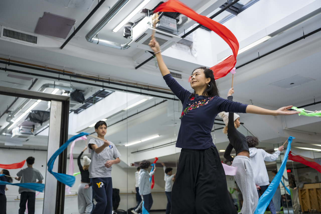 Ling Tang leads students through a ribbon-dance sequence.