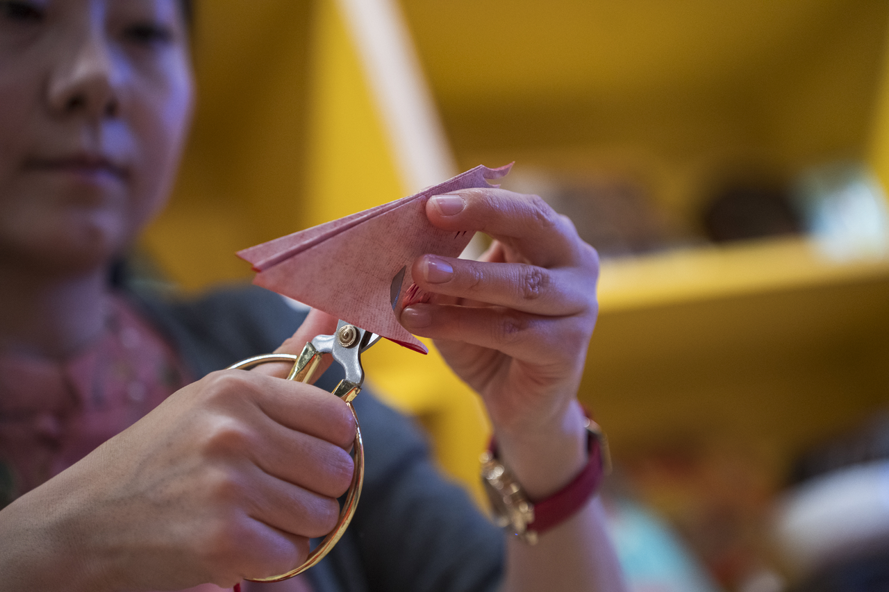 Tang teaches paper cutting, another way she shares culture beyond dance.