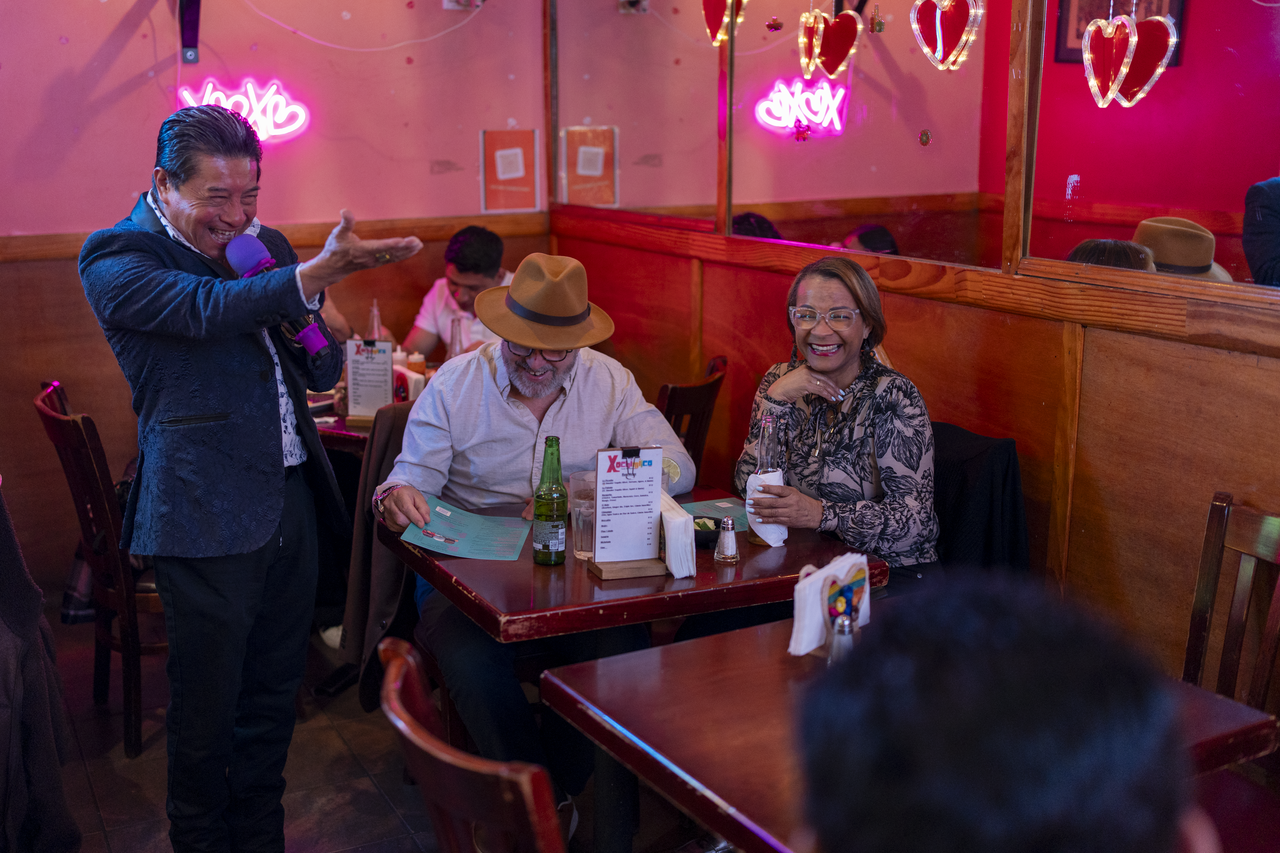 He carries the song through the room and up to the guests’ tables.